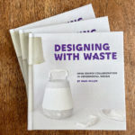 three stacked copies of the "Designing with Waste: open source collaboration in experimental design" hardcover book