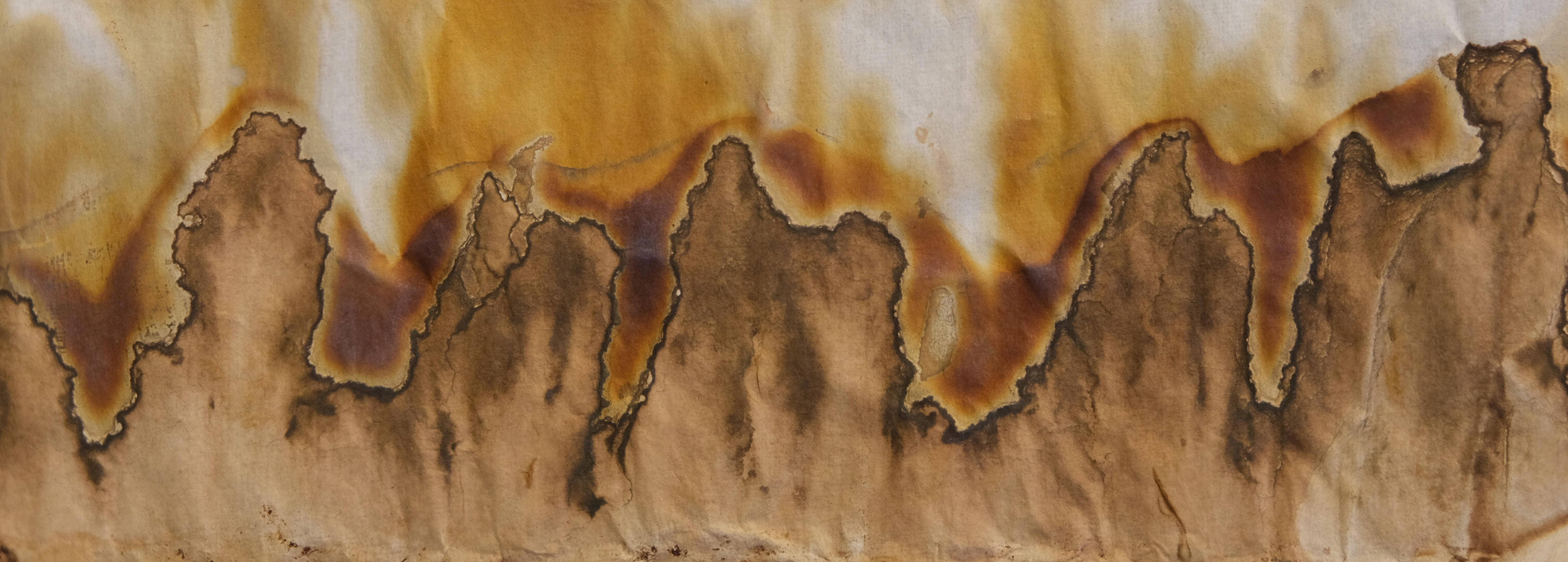 abstract splotches that ripple across the paper, almost like flames or steep mountains