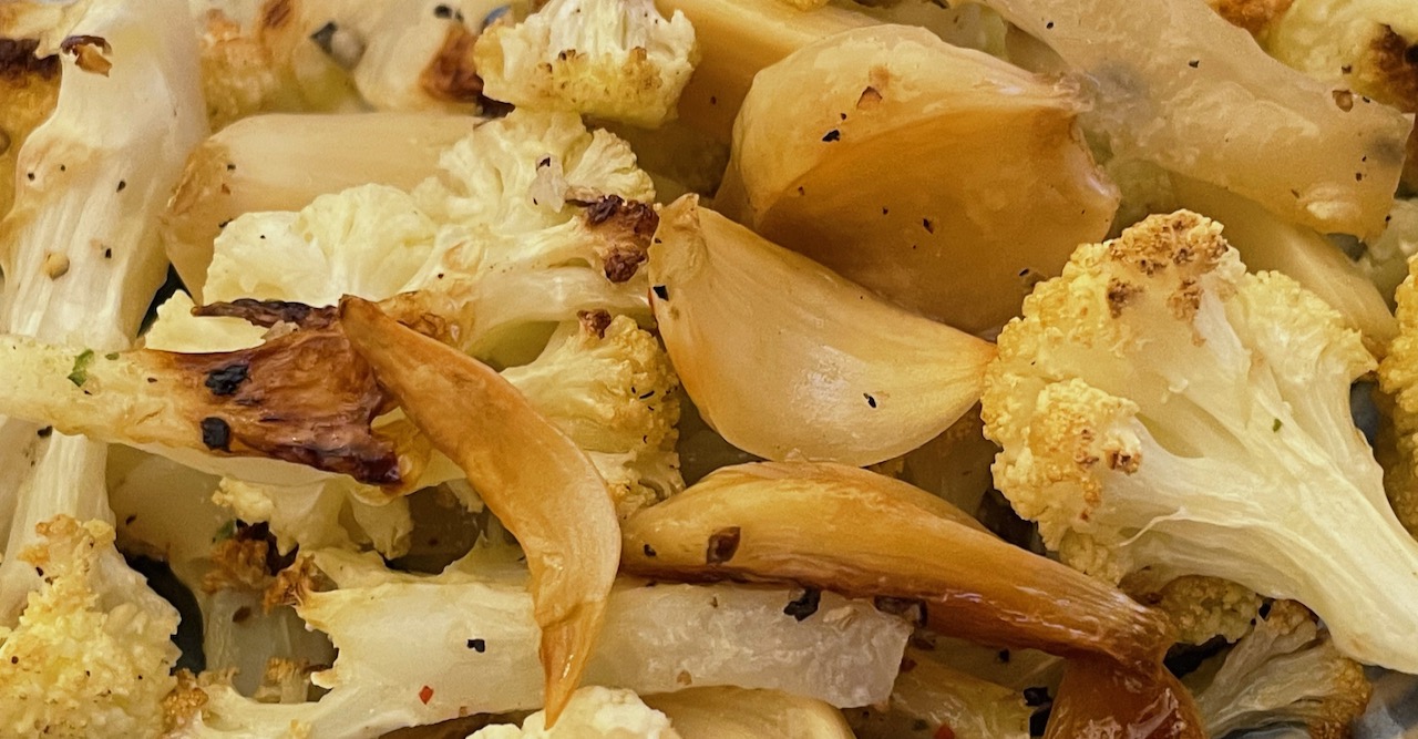 roasted cauliflower and garlic, sprinkled with ground pepper